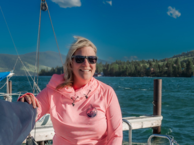 a person holding a fish in the water