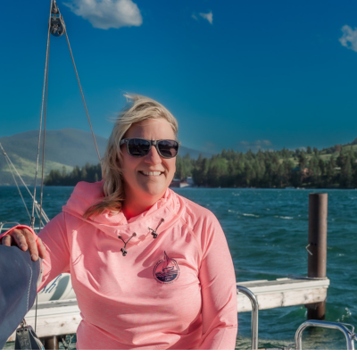 a person holding a fish in the water