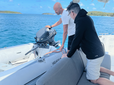 a person sitting on a boat in the water