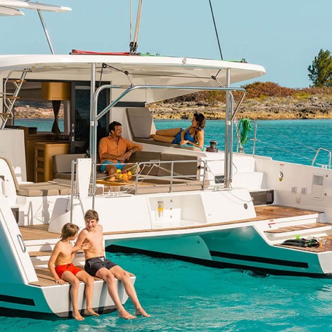 a person riding on the back of a boat