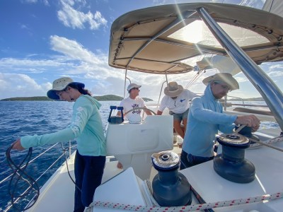 a group of people standing on a boat