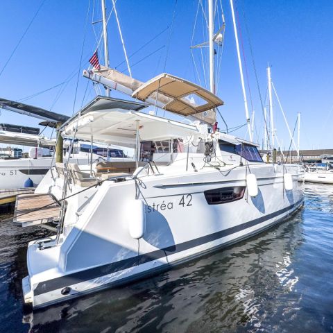 a boat is docked next to a body of water