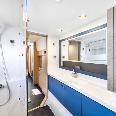 a room with a sink and a mirror